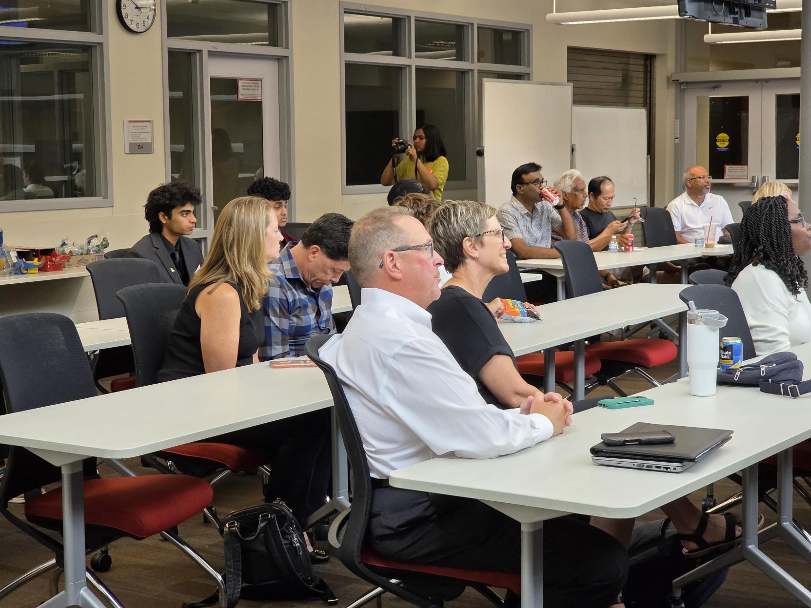 Parents watch a teammate present during the camp showcase.
